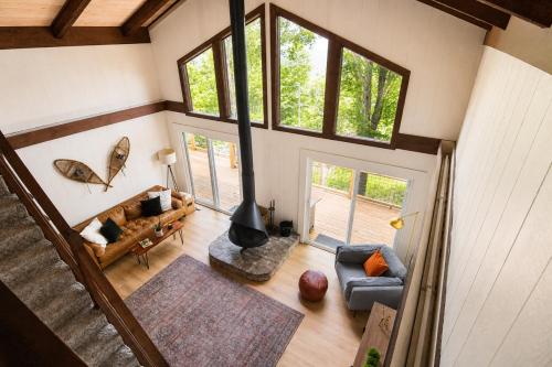 an overhead view of a living room with a fireplace at Modern Chalet Hot Tub Game Loft 1 Mi to Skiing in Beech Mountain