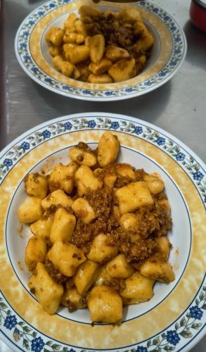 two plates of food on top of a table at Agriturismo Maremma Amara in Saturnia