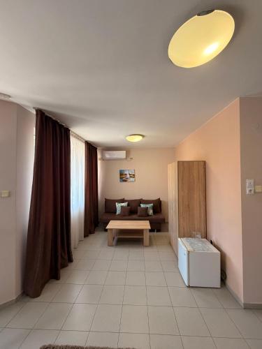 a living room with a couch and a table at Top Center House in Plovdiv