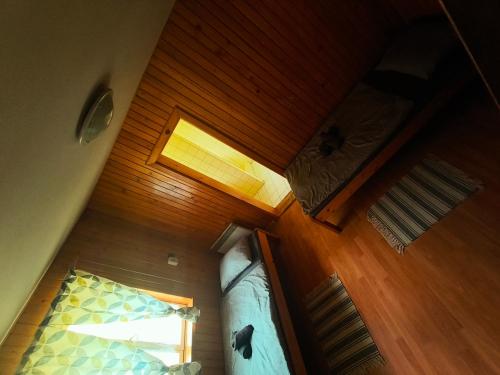 an overhead view of a bedroom with a bed and a ceiling at Grizzly Krpáčovo in Dolná Lehota