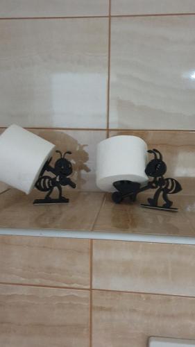 a couple of lights that are on a wall at Elly in Modriča