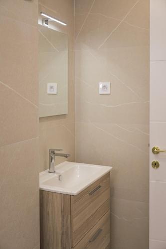 a bathroom with a sink and a mirror at Etno selo Azbuka in TrÅ¡iÄ‡
