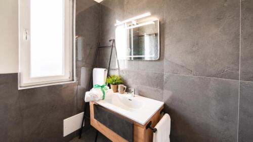a bathroom with a sink and a mirror at Brahma luxury B&B in Marigliano