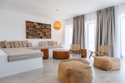a living room with a couch and a table at Antiparos Gems - The villa in Antiparos