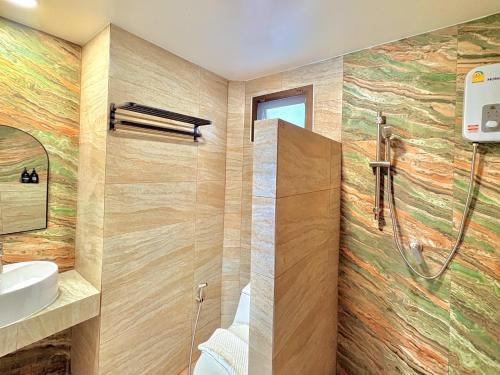 a bathroom with a shower and a sink at A1-Mountain View Private Pool Villa-บางแสน in Chon Buri
