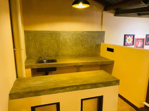 a kitchen with a sink and a counter top at Thisu Villa in Dickwella