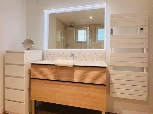 a bathroom with a large sink and a mirror at L'Accalmie - Résidence calme, Plein centre, Plain pied in Crest