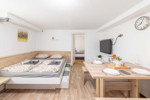 a bedroom with a bed and a desk at Poli in Šmarje-Sap