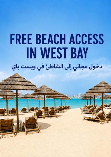 a beach with chairs and umbrellas and the words free beach access in west at Hampton By Hilton Doha Old Town in Doha