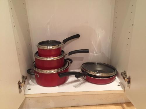 two pots and pans on a stove in a drawer at Downtown Big 1 Bedroom #20I in Atlanta