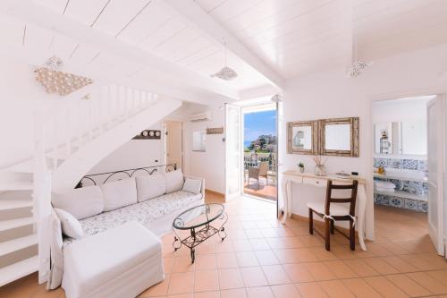 a living room with a couch and a table at Villa Mary Suites in Positano