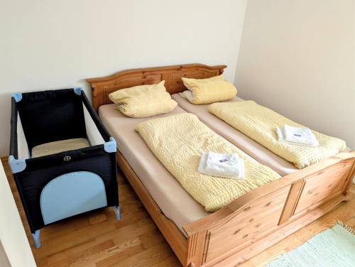 a bedroom with two beds with yellow pillows at Ferienwohnung Weiding in Rutzenmoos
