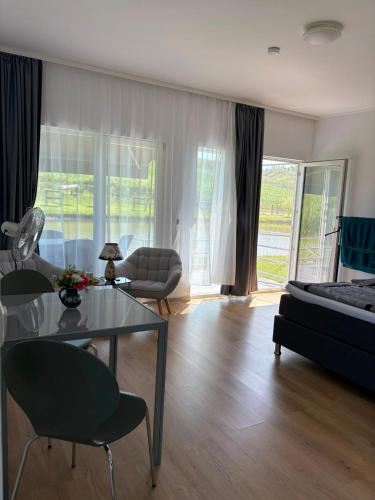 a living room with a glass table and a couch at Lacurile IRION in Hoghilag