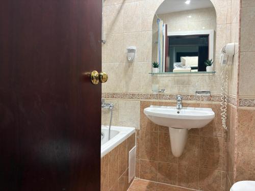 a bathroom with a sink and a mirror at Miramar Palace 612S in Sunny Beach