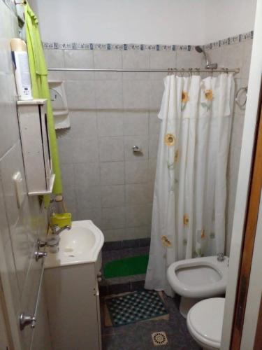 a bathroom with a toilet and a sink and a shower at Los 2 Hermanos in Tanti