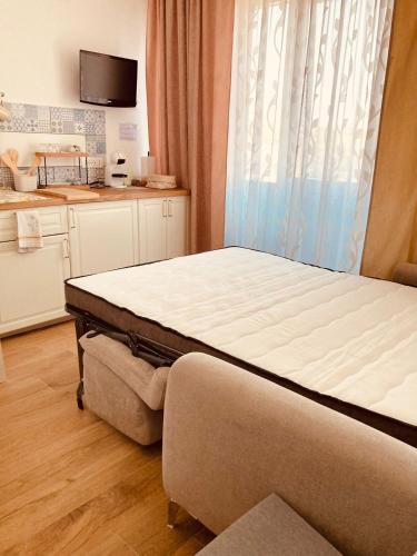 a bed in a room with at Casa Di Luce Junior Con Parcheggio Privato in Montesilvano
