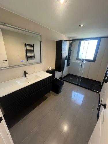 a bathroom with a sink and a mirror at Caribe in Platja d'Aro