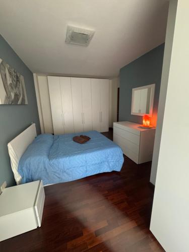 a small bedroom with a bed and a night stand at Casa Margot in Villaverla