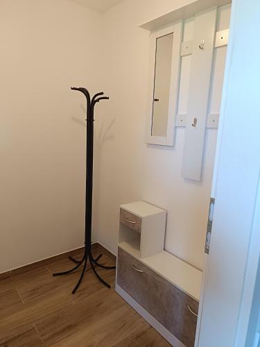 a room with a mirror and a dresser and a lamp at M&M house in Bizeljsko