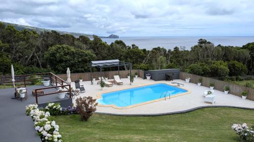 an overhead view of a swimming pool in a backyard at Villa Capelinhos in Capelo