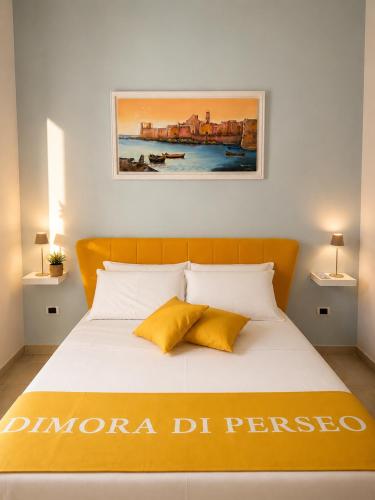 a bedroom with a bed with a poster on the wall at ladimoradiperseo in Giovinazzo