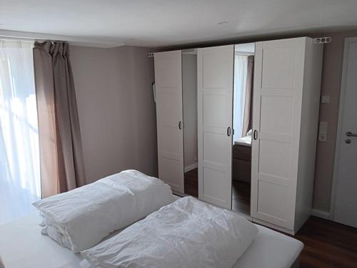 a bedroom with a bed and a large mirror at Ferienwohnung unterm Kirschbaum in Großenlüder