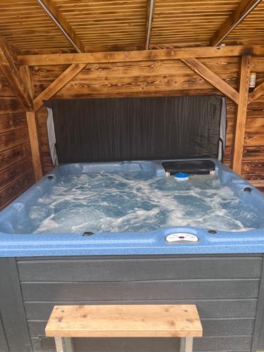 a large jacuzzi tub sitting in a roof at apartmany agnieszka in Smižany