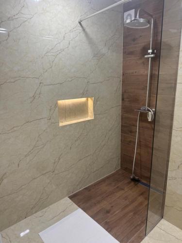 a shower with a glass door in a bathroom at Premium Rooms in Struga