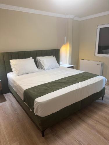 a bedroom with a large bed in a room at Premium Rooms in Struga