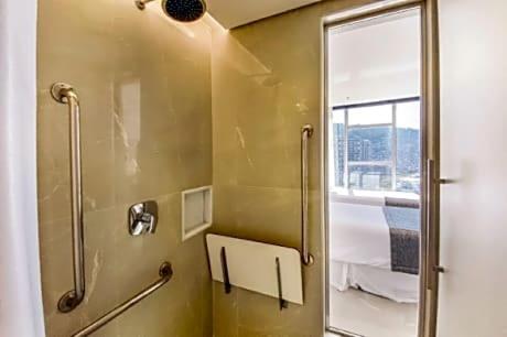 a bathroom with a shower and a mirror at Hotel Nacional in Rio de Janeiro