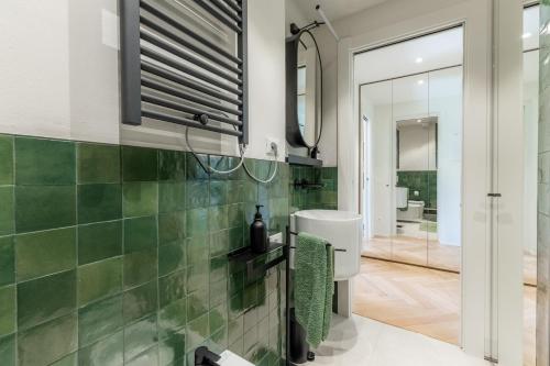 a bathroom with a sink and a mirror at Lakeside Garden Studio in Laglio