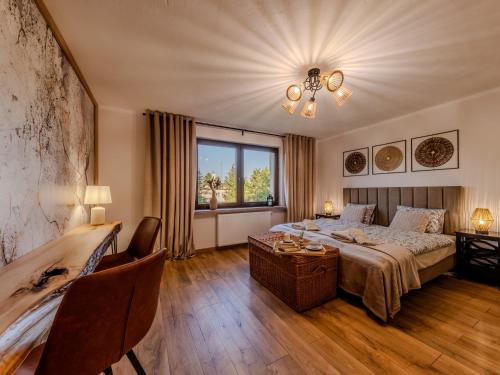 a hotel room with a bed and a window at OSNOWA Racławice in Racławice