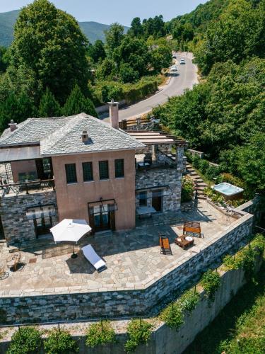 an aerial view of a stone building with a patio at A Dream Deferred villa Pelion in Kissos