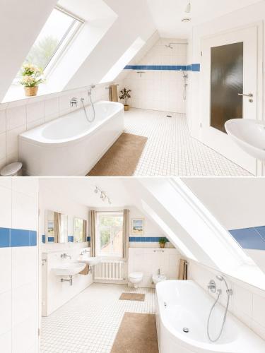 a white bathroom with blue and white tiles at Ferienhaus an der Lohheide in Walsrode