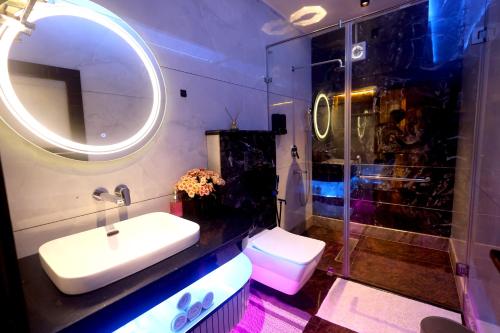 a bathroom with a sink and a mirror at Aman Homestay, A Boutique Hotel in Agra