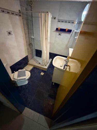 a bathroom with a shower and a toilet and a sink at Kiki by the sea Villa in Paralia Katerinis
