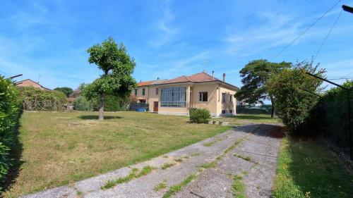 a house with a yard in front of it at Casa Picarol Monferrato in Bergamasco