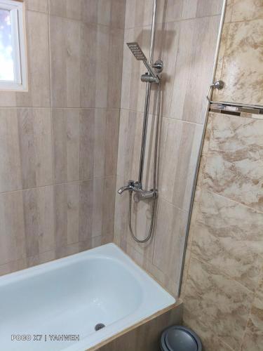 a bathroom with a shower with a shower head at Yahweh in Río Grande