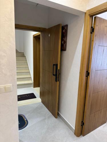 a room with a door and a stairway at اقامة هبة 4 in Yebha