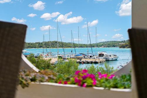 a view of a marina with boats in the water at Irene Bed & Breakfast Tisno in Tisno