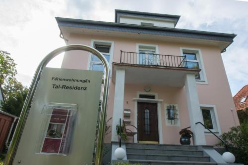a house with a sign in front of it at Tal-Residenz Whg 3 in Bad Salzuflen
