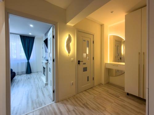 an empty room with a door and a hallway at Luu's Studio! in Hunedoara