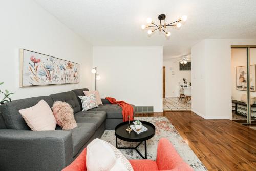 a living room with a couch and a table at Fabulous Home-King bed-Easy Access to EVERyTHING! in Edmonton