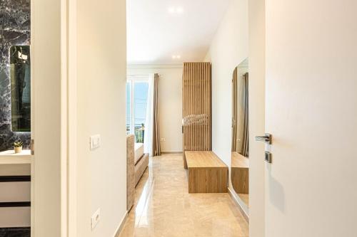 a hallway with a door leading to a bathroom at New Dhermi Icon 2 - Parking in Dhërmi