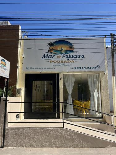 a store front of a restaurant with a sign on it at Pousada Mar de Pajuçara in Maceió