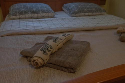 a couple of beds with towels on them at Kovaci Garden House in Sarajevo