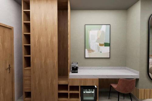 a dressing room with a desk and a mirror at Wyndham Garden Durango in Durango