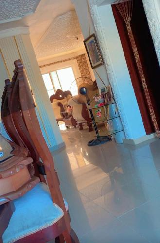 a view of a living room with a chair and a staircase at Villa panamericana in El Seis