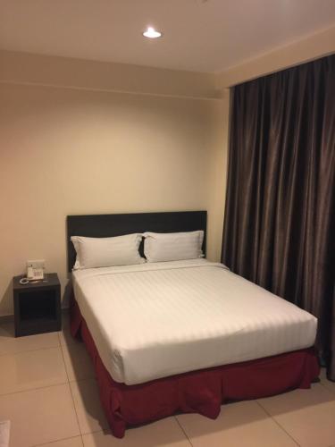 Cama o camas de una habitación en Premierz Hotel