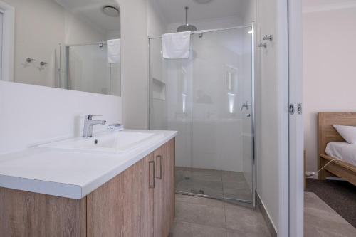 a bathroom with a sink and a shower at Beaufort Lake Caravan Park in Beaufort